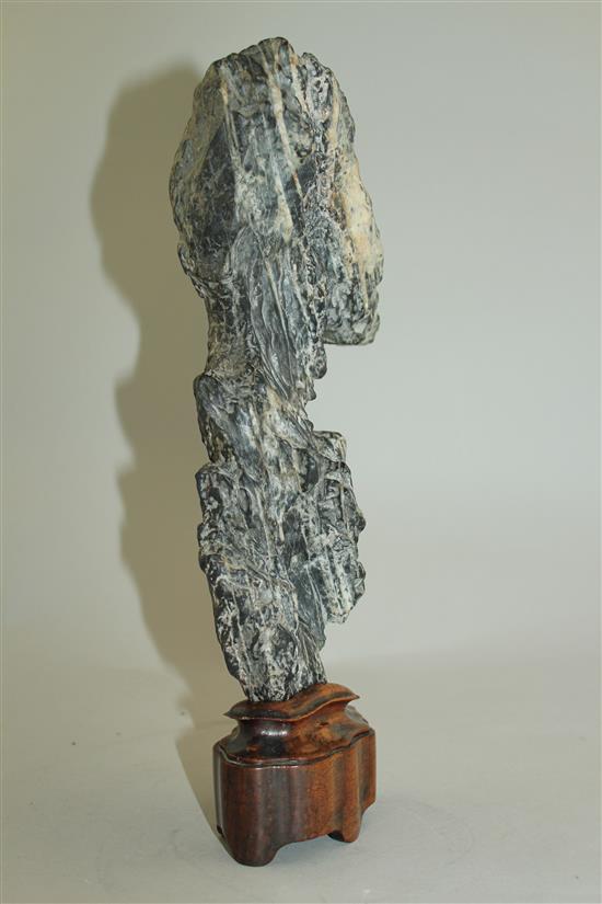 A Chinese scholars rock, late 19th / early 20th century, total height 31.5cm